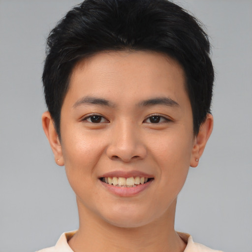 Joyful asian young-adult female with short  black hair and brown eyes