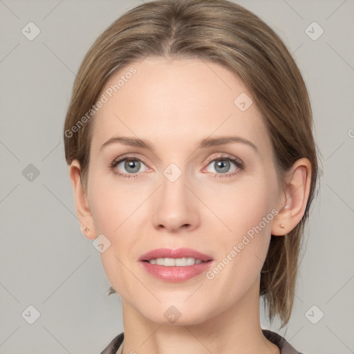 Joyful white young-adult female with medium  brown hair and grey eyes