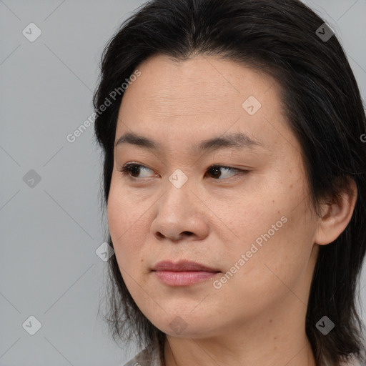 Joyful asian young-adult female with medium  brown hair and brown eyes