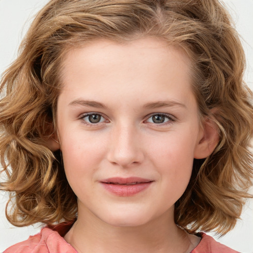 Joyful white child female with medium  brown hair and brown eyes