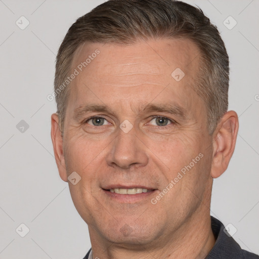 Joyful white middle-aged male with short  brown hair and brown eyes