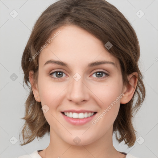 Joyful white young-adult female with medium  brown hair and green eyes