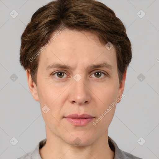 Joyful white adult male with short  brown hair and grey eyes