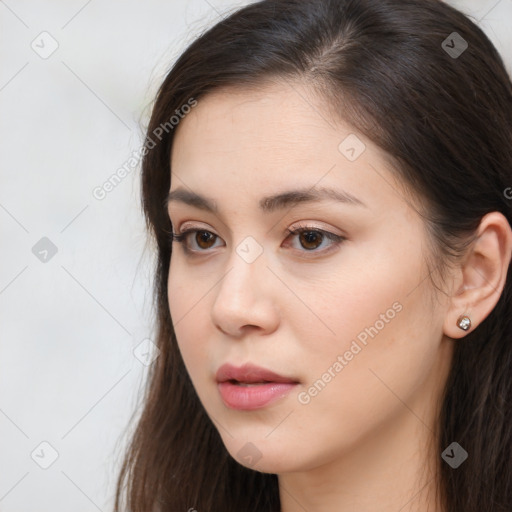 Neutral white young-adult female with long  brown hair and brown eyes