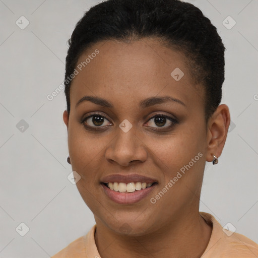 Joyful black young-adult female with short  brown hair and brown eyes