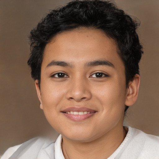 Joyful latino young-adult male with short  brown hair and brown eyes
