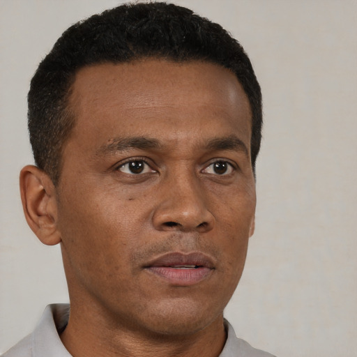 Neutral black young-adult male with short  brown hair and brown eyes