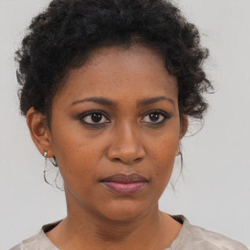 Neutral black young-adult female with short  brown hair and brown eyes