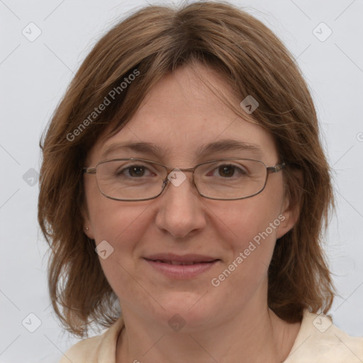 Joyful white adult female with medium  brown hair and blue eyes