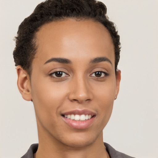 Joyful latino young-adult female with short  brown hair and brown eyes