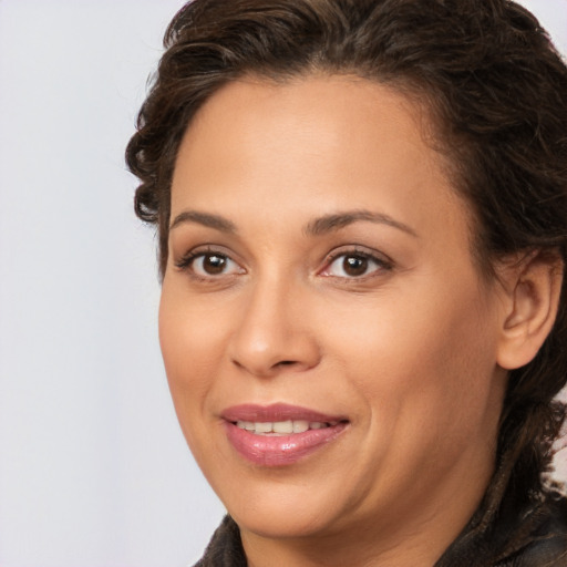 Joyful white adult female with long  brown hair and brown eyes