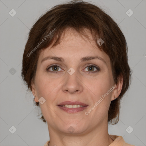 Joyful white adult female with medium  brown hair and grey eyes