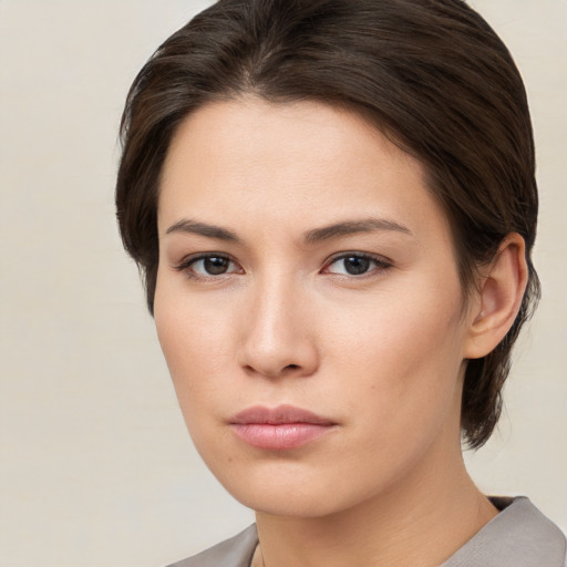 Neutral white young-adult female with medium  brown hair and brown eyes