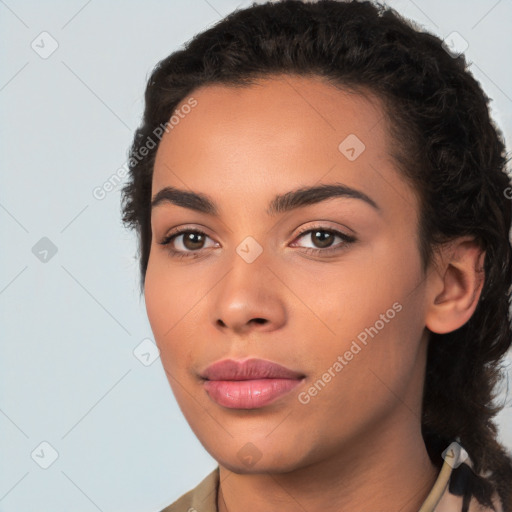 Joyful white young-adult female with long  black hair and brown eyes