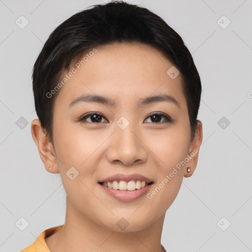 Joyful asian young-adult female with short  brown hair and brown eyes