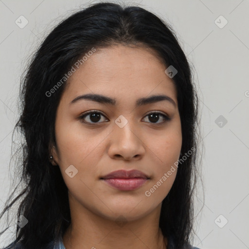 Joyful latino young-adult female with long  brown hair and brown eyes