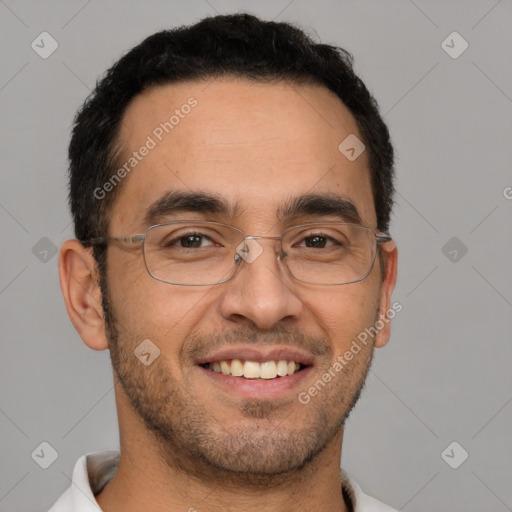 Joyful white adult male with short  black hair and brown eyes