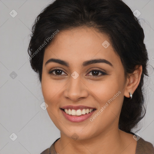 Joyful latino young-adult female with medium  brown hair and brown eyes