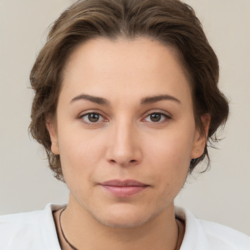 Neutral white young-adult female with short  brown hair and brown eyes