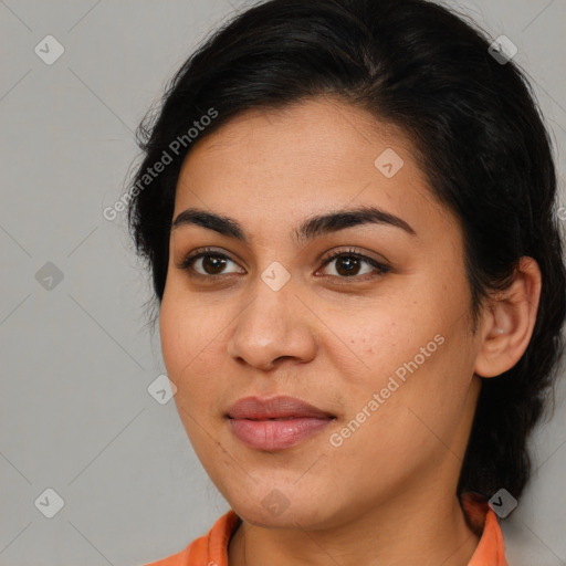 Joyful latino young-adult female with medium  brown hair and brown eyes