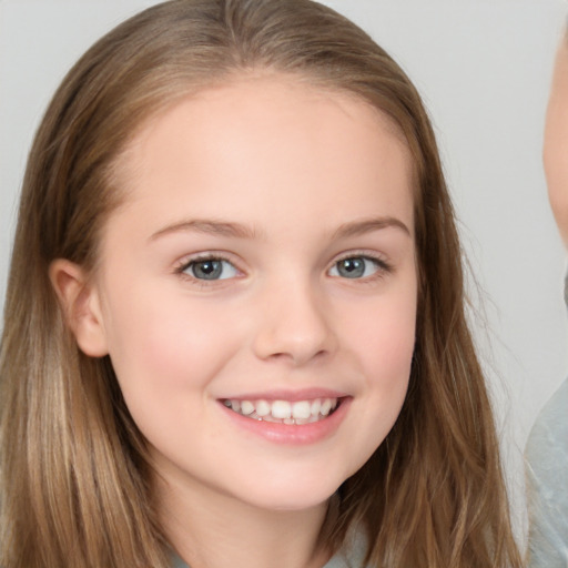 Joyful white child female with long  brown hair and brown eyes