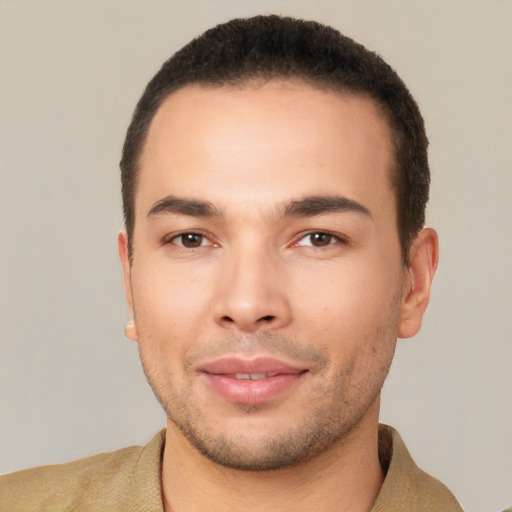 Joyful white young-adult male with short  black hair and brown eyes