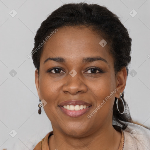 Joyful black young-adult female with short  brown hair and brown eyes