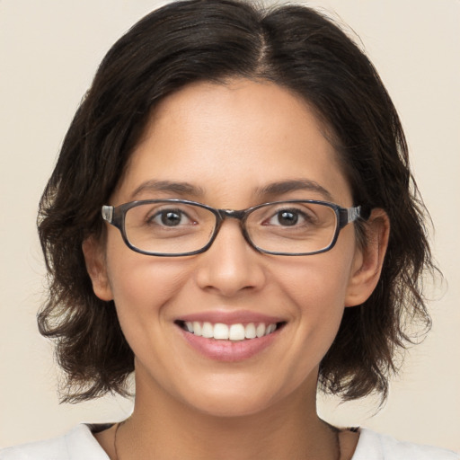 Joyful white young-adult female with medium  brown hair and brown eyes