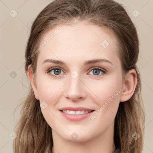 Joyful white young-adult female with medium  brown hair and green eyes