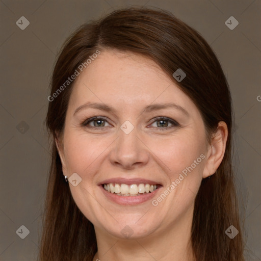 Joyful white adult female with long  brown hair and brown eyes