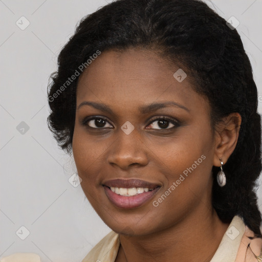 Joyful black young-adult female with long  brown hair and brown eyes