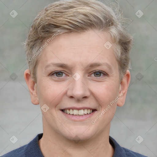 Joyful white adult female with short  brown hair and grey eyes