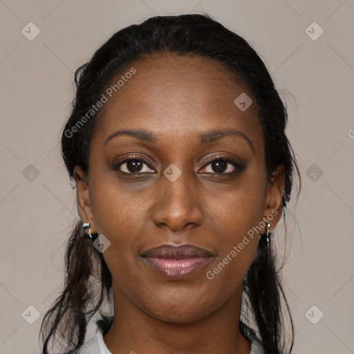Joyful black adult female with medium  brown hair and brown eyes