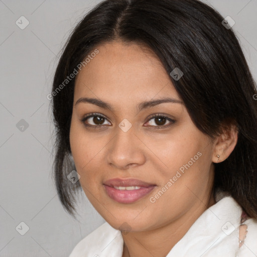 Joyful latino young-adult female with medium  brown hair and brown eyes