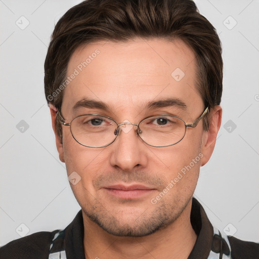 Joyful white adult male with short  brown hair and grey eyes