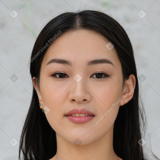 Joyful asian young-adult female with long  black hair and brown eyes