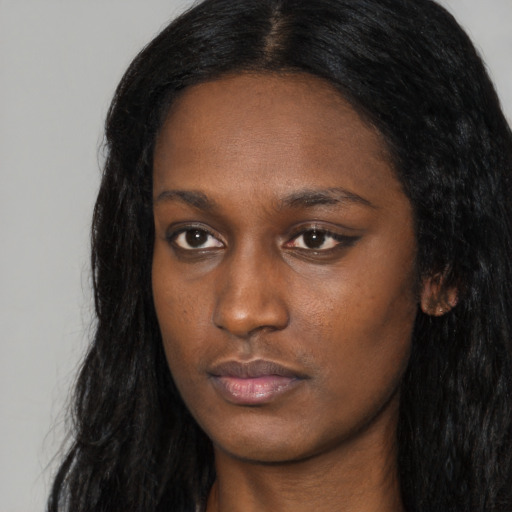 Neutral black young-adult female with long  black hair and brown eyes