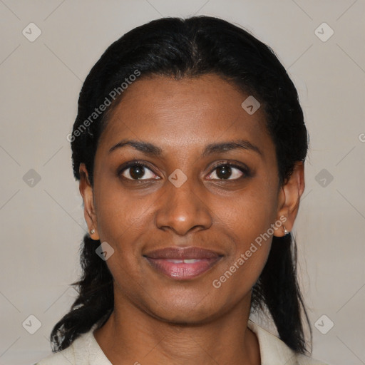 Joyful black young-adult female with medium  black hair and brown eyes