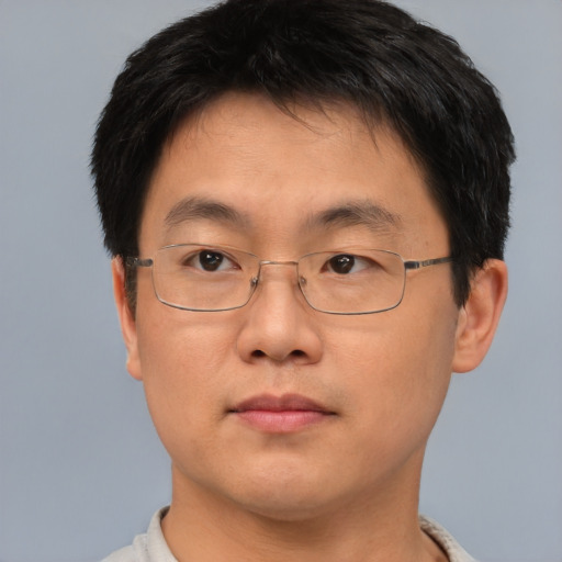 Neutral asian adult male with short  brown hair and brown eyes