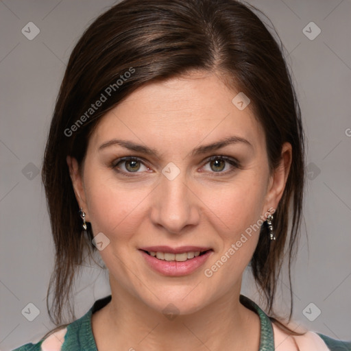 Joyful white young-adult female with medium  brown hair and grey eyes