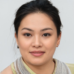 Joyful asian young-adult female with short  brown hair and brown eyes