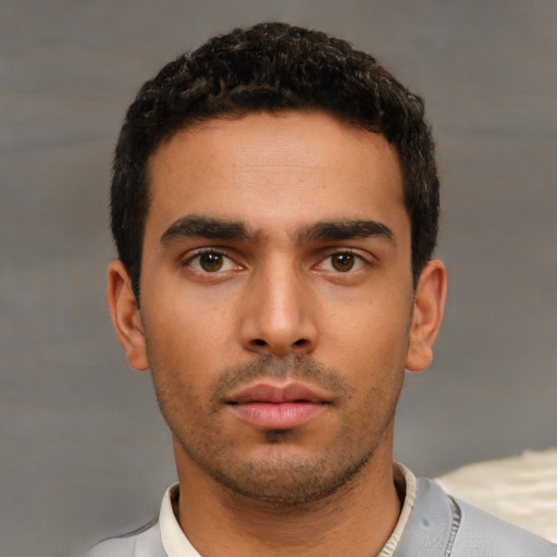 Neutral white young-adult male with short  black hair and brown eyes