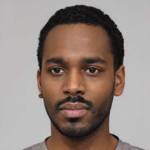 Neutral black young-adult male with short  black hair and brown eyes