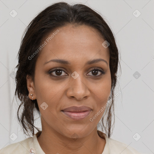 Joyful black young-adult female with long  brown hair and brown eyes