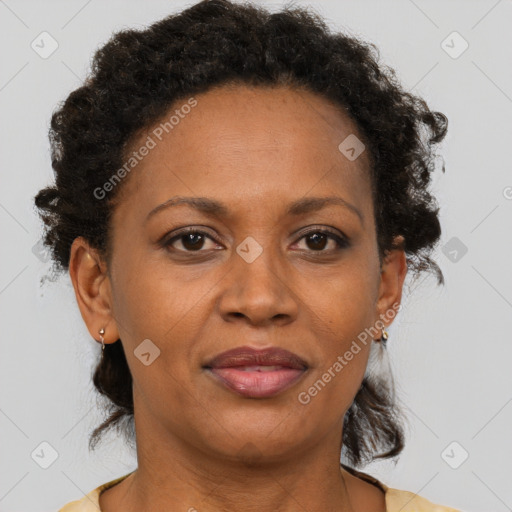 Joyful black adult female with short  brown hair and brown eyes