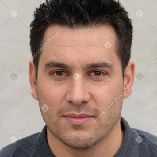 Joyful white adult male with short  brown hair and brown eyes