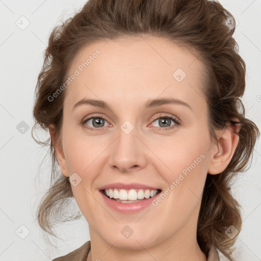 Joyful white young-adult female with medium  brown hair and blue eyes