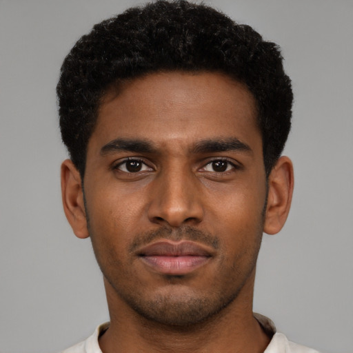 Neutral latino young-adult male with short  brown hair and brown eyes