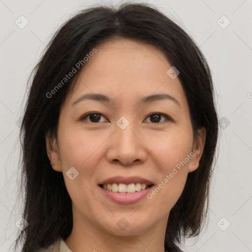 Joyful asian young-adult female with medium  brown hair and brown eyes