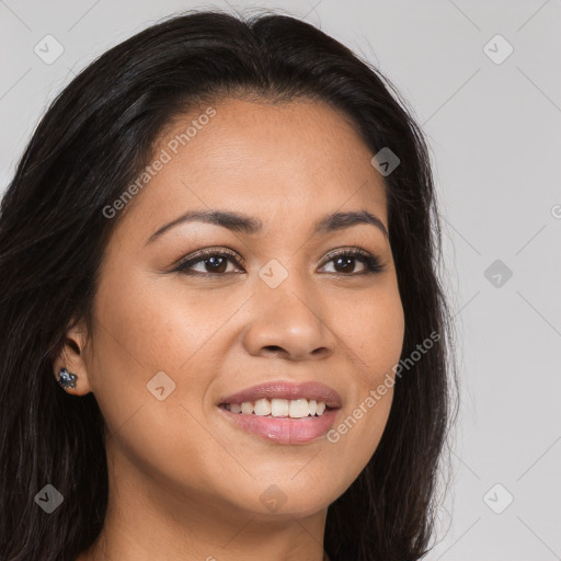 Joyful latino young-adult female with long  brown hair and brown eyes